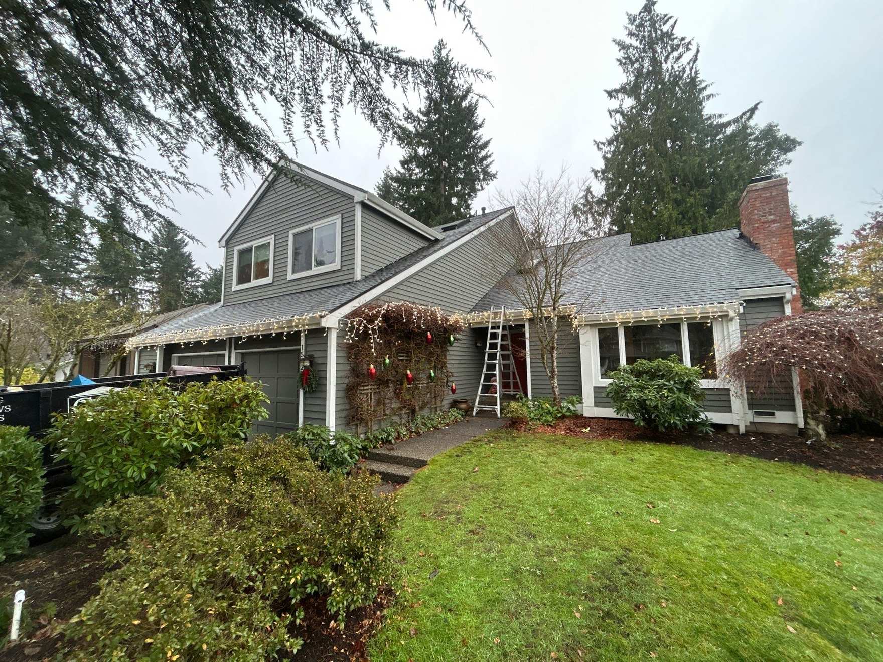 Pacific Northwest home with its roofline in view during a storm
