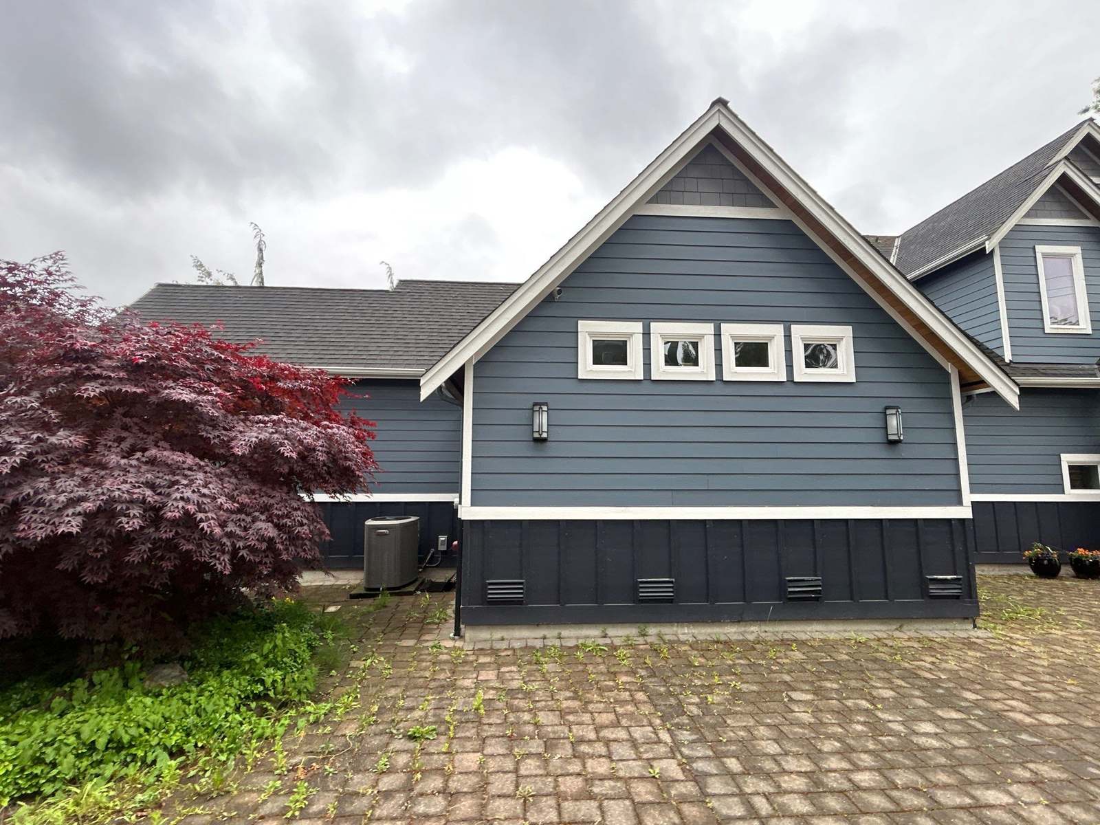 Finished James Hardie siding on a blue lakeside home in Lake Stevens