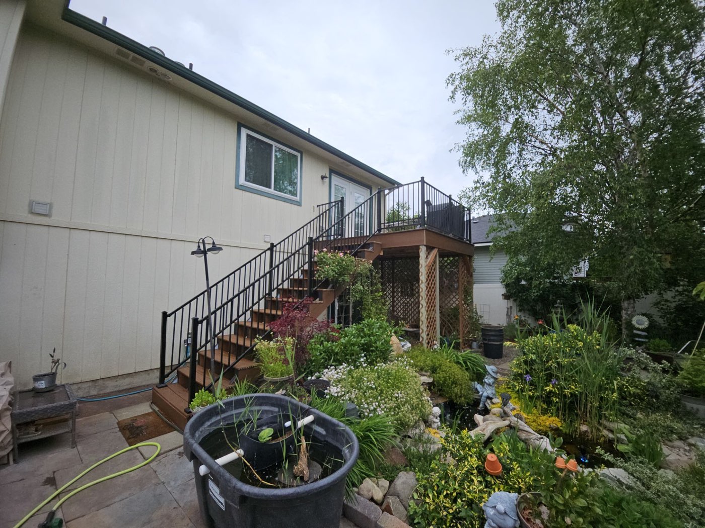 Custom deck with black metal railing